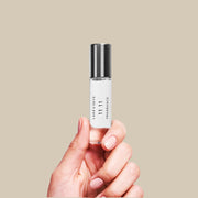 A clear bottle of fragrance oil with a silver screw on lid and black text that reads, 'Lake & Skye 11 11 Fragrance'. 