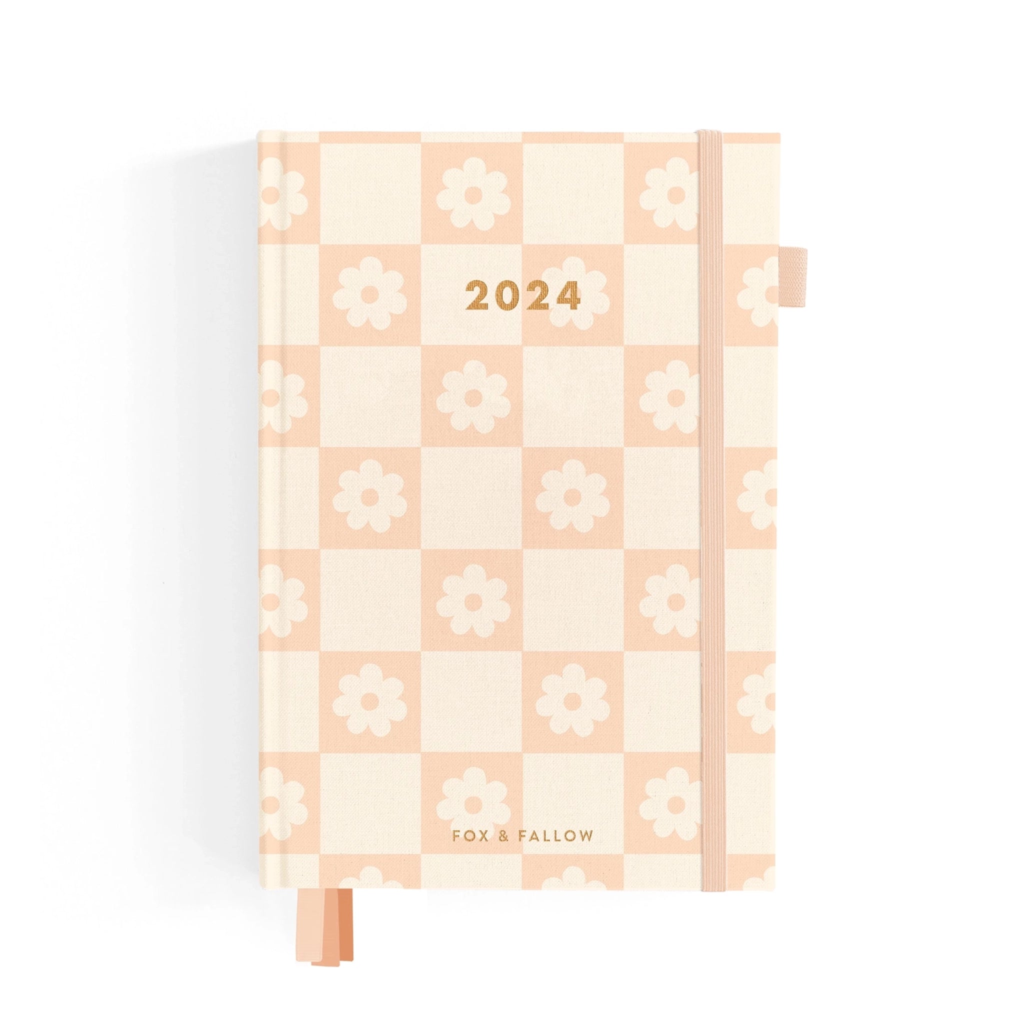 On a white background is a light pink and ivory checkered planner with gold foiled &quot;2024&quot; text in the center along with a light pink elastic loop for keeping shut. 