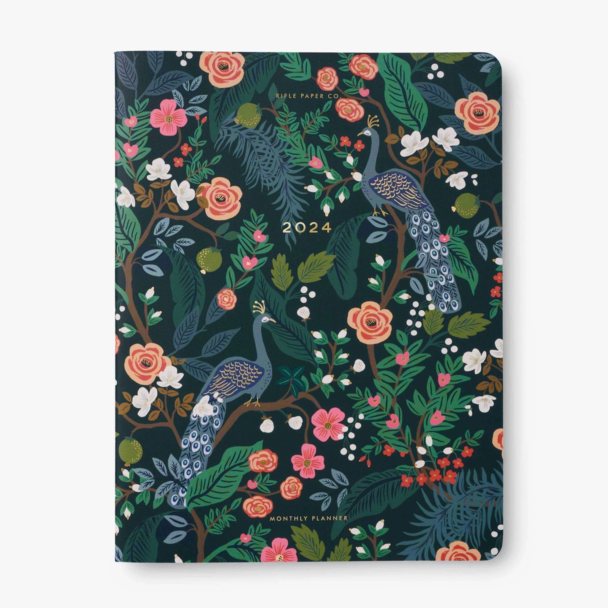 On a white background is a planner with a front cover featuring a peacock and flower design along with &quot;2024&quot; in small gold foiled text in the center. 