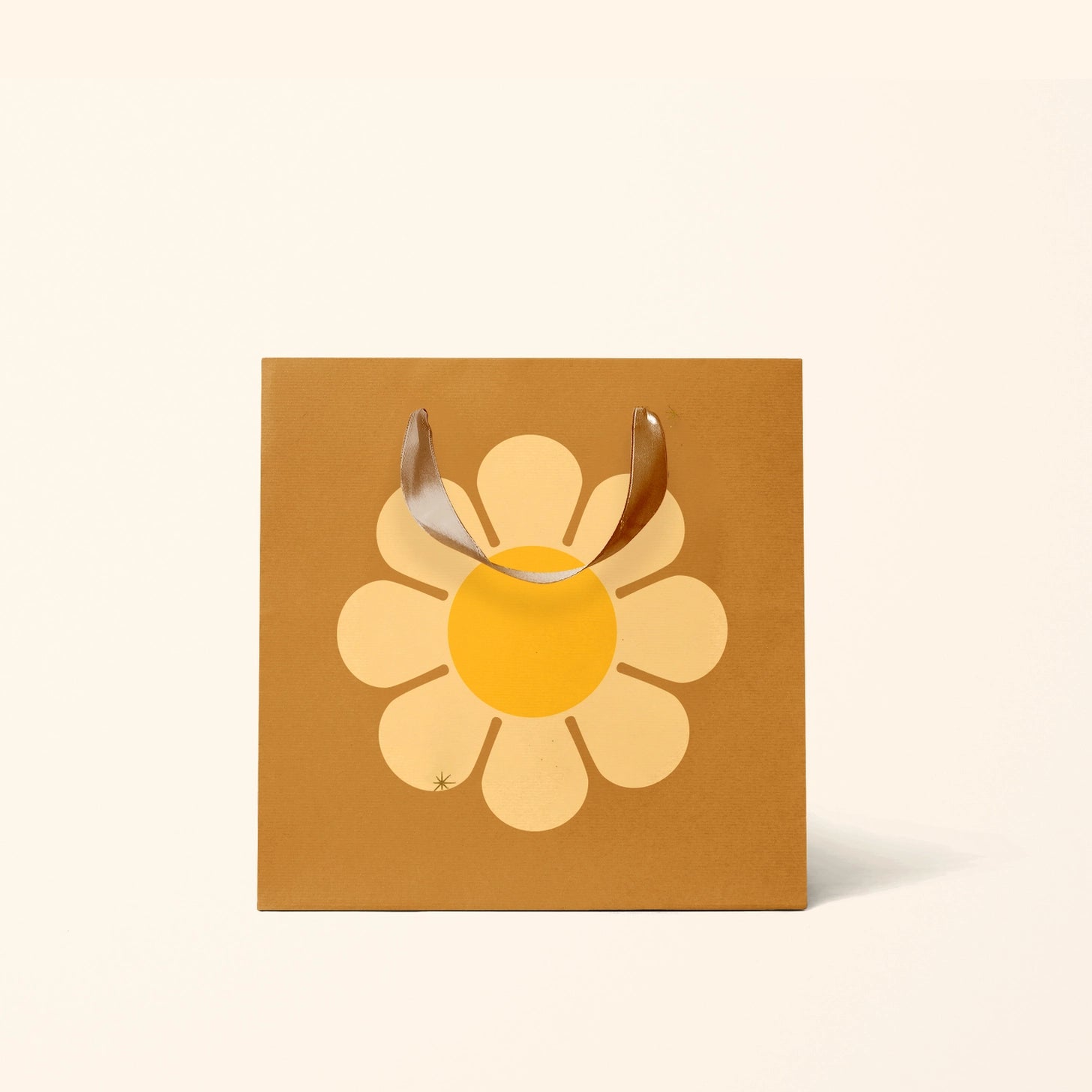 On a white background is a brown gift bag with a large yellow daisy in the center. 