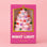 A pink Christmas tree-shaped night light in its original packaging, featuring a clear window that shows the light on, with colorful bulb accents. The box is pink with gold trim and white text reading 'VINTAGE NIGHT LIGHT' and 'SUNSHINESTUDIOS'.