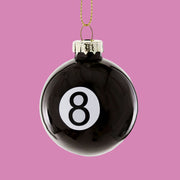 A glass eight ball shaped ornament. 