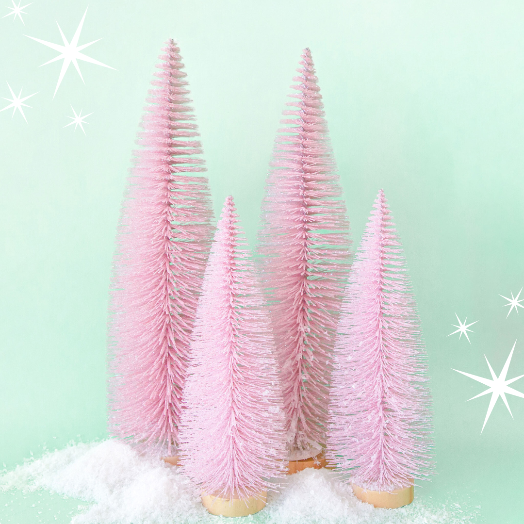 Pink bottle brush sparkly trees on a mint background.