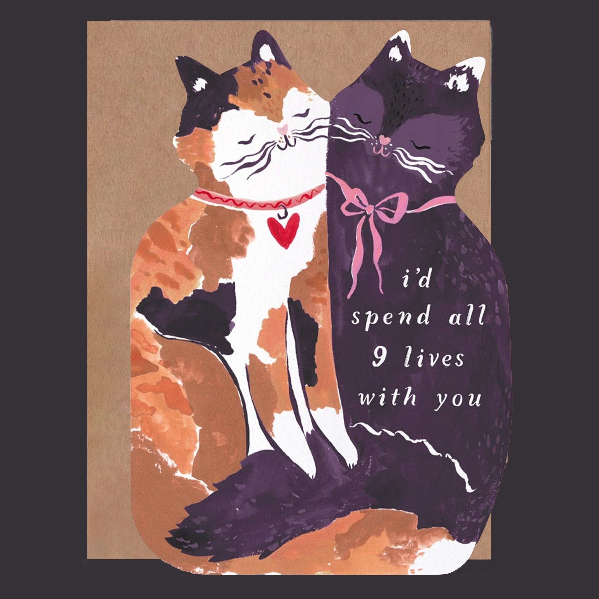 A card with a cutout of two cats with text that reads, &#39;i&#39;d spend all 9 lives with you&#39;. 