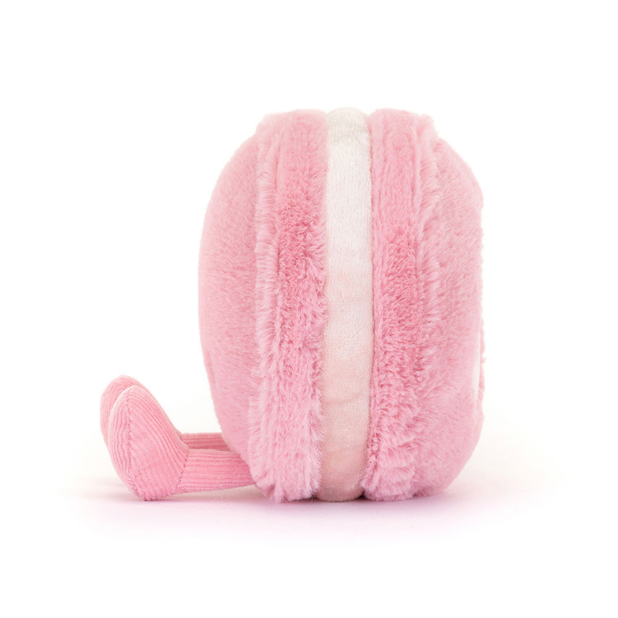 a pink maracon shaped plush toy with corduroy feet and a smiling face. 