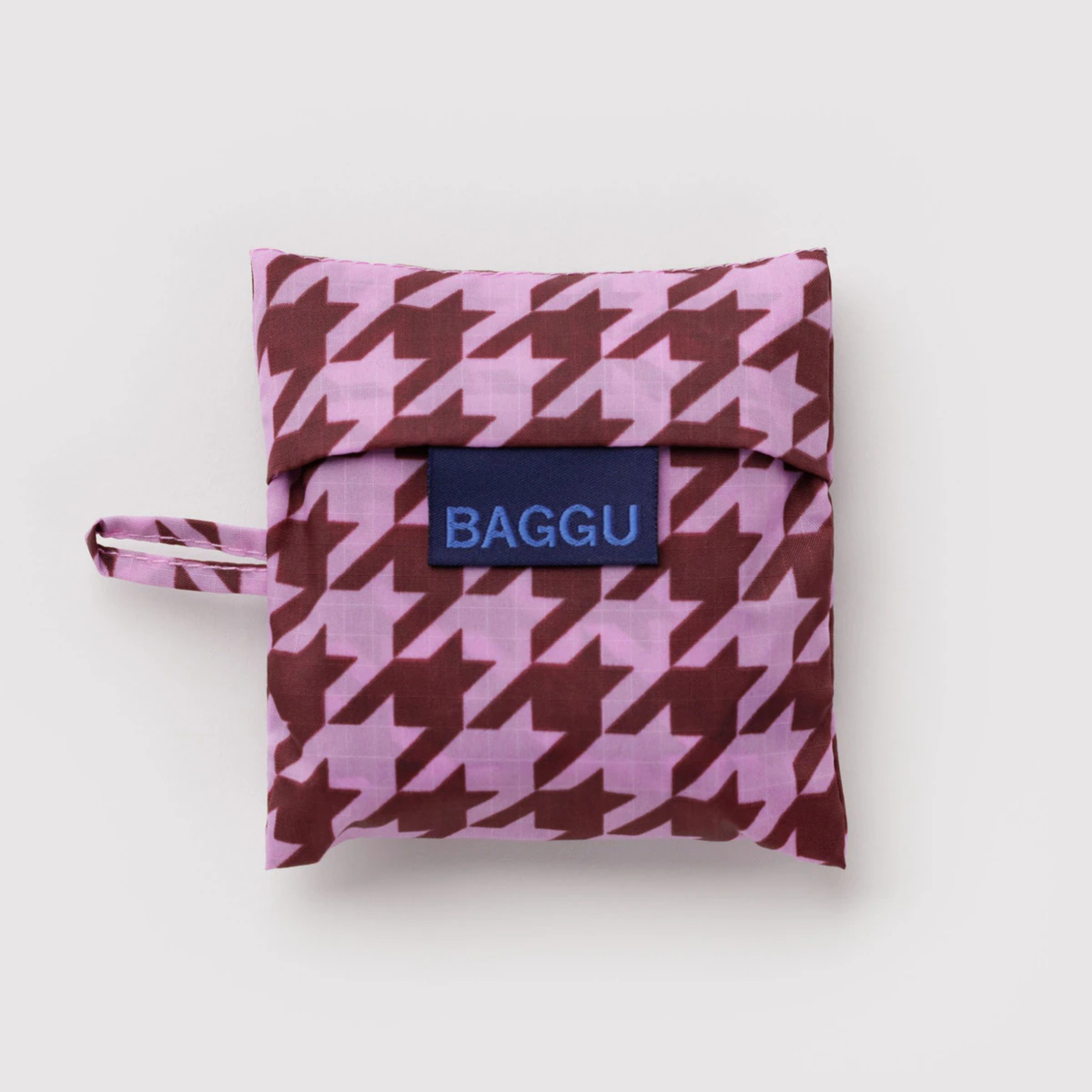 A pink and burgundy pattern nylon tote bag.