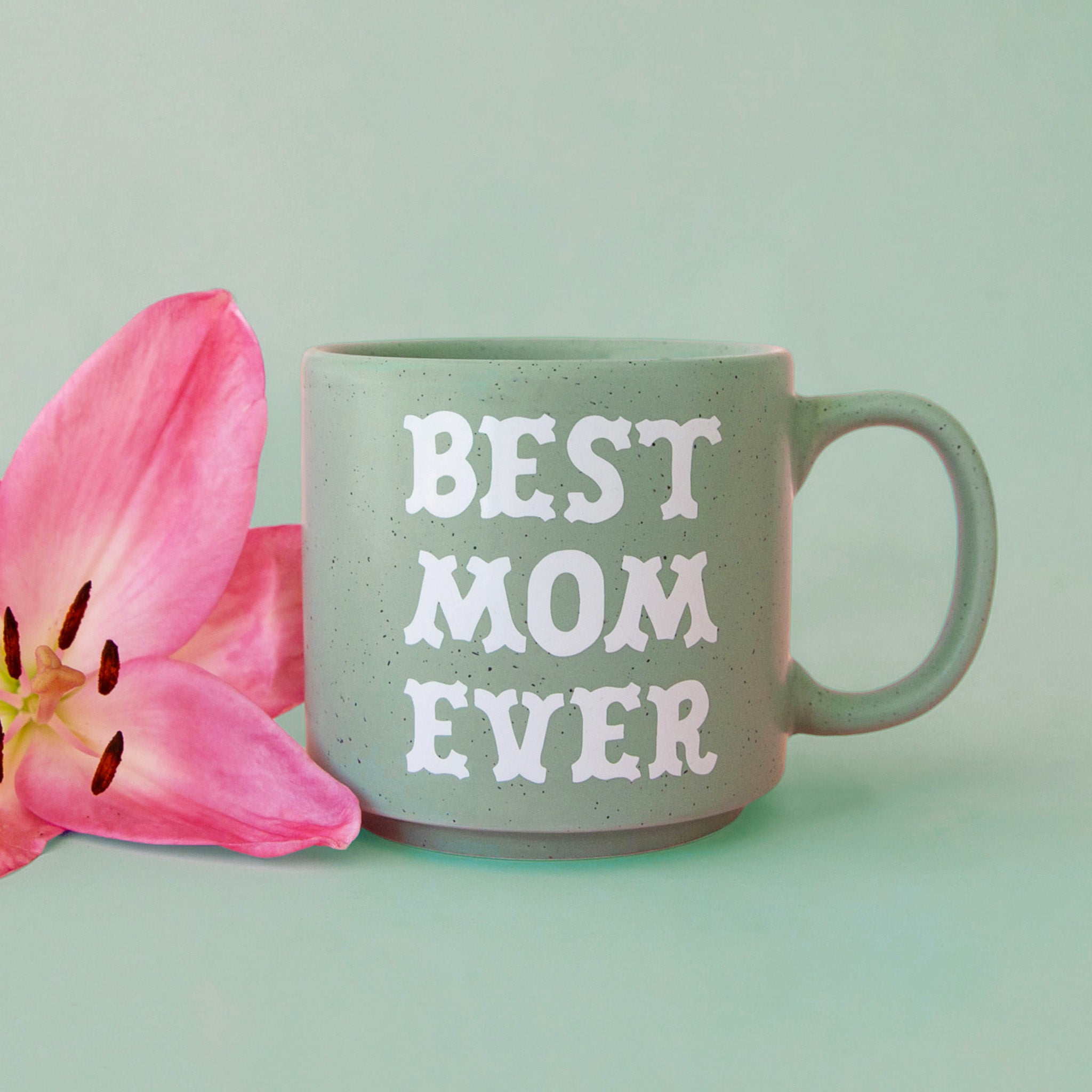 A mint green speckle mug with white text that reads, "Best Mom Ever". 