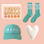 A pair of turquoise socks with white writing that reads "Best Mom Ever", a corduroy cap in turquoise with white stitching that reads "MAMA", a greeting card that reads "Happy Mother's Day" with floral illustrations and a white heart shaped ceramic dish.