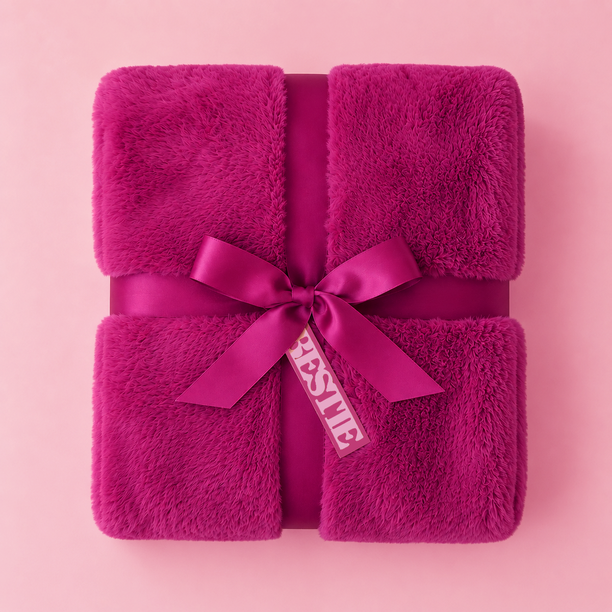 hot pink fur blanket with a tag that reads "bestie".
