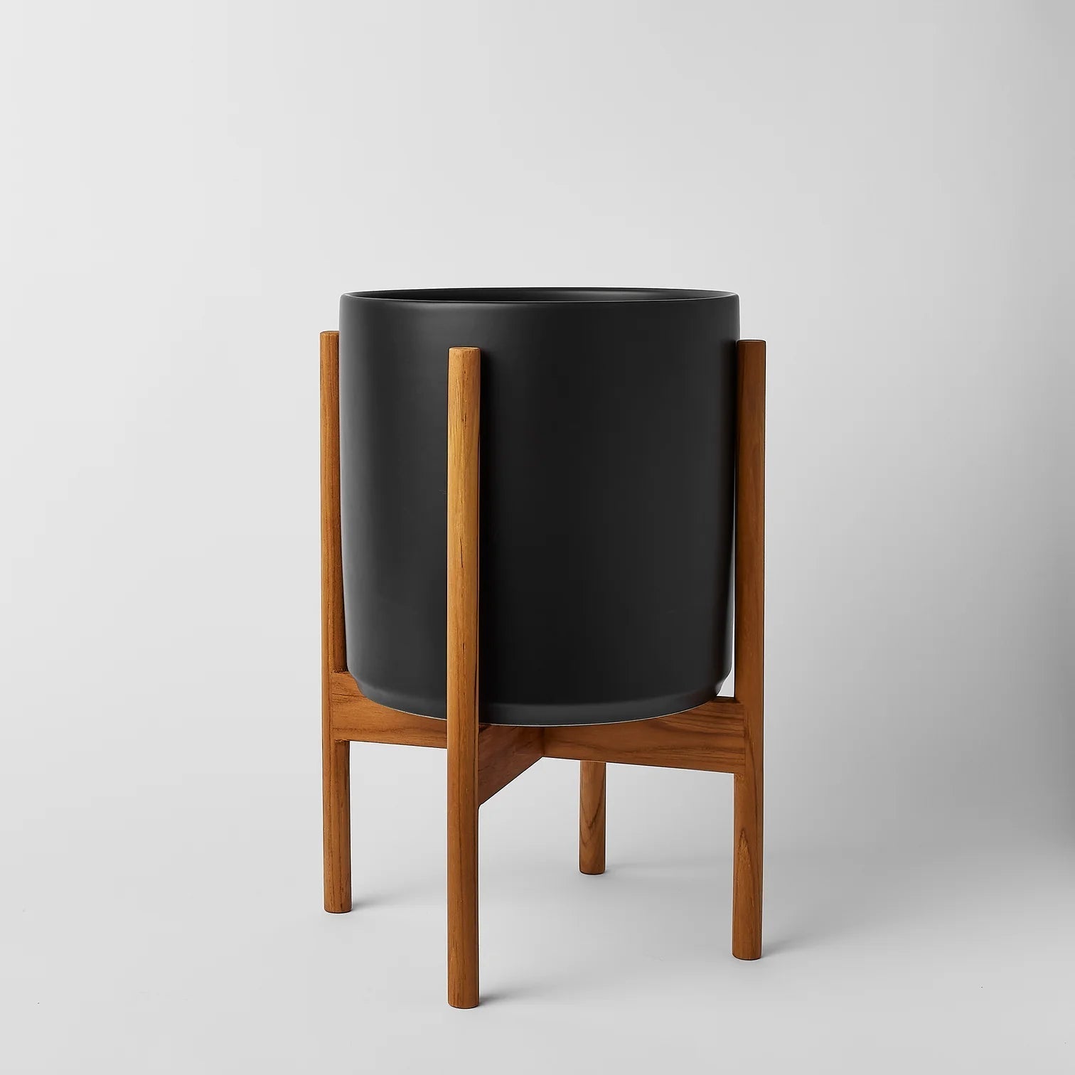 black plant pot with legs The Ten Planter With Stand – Pigment