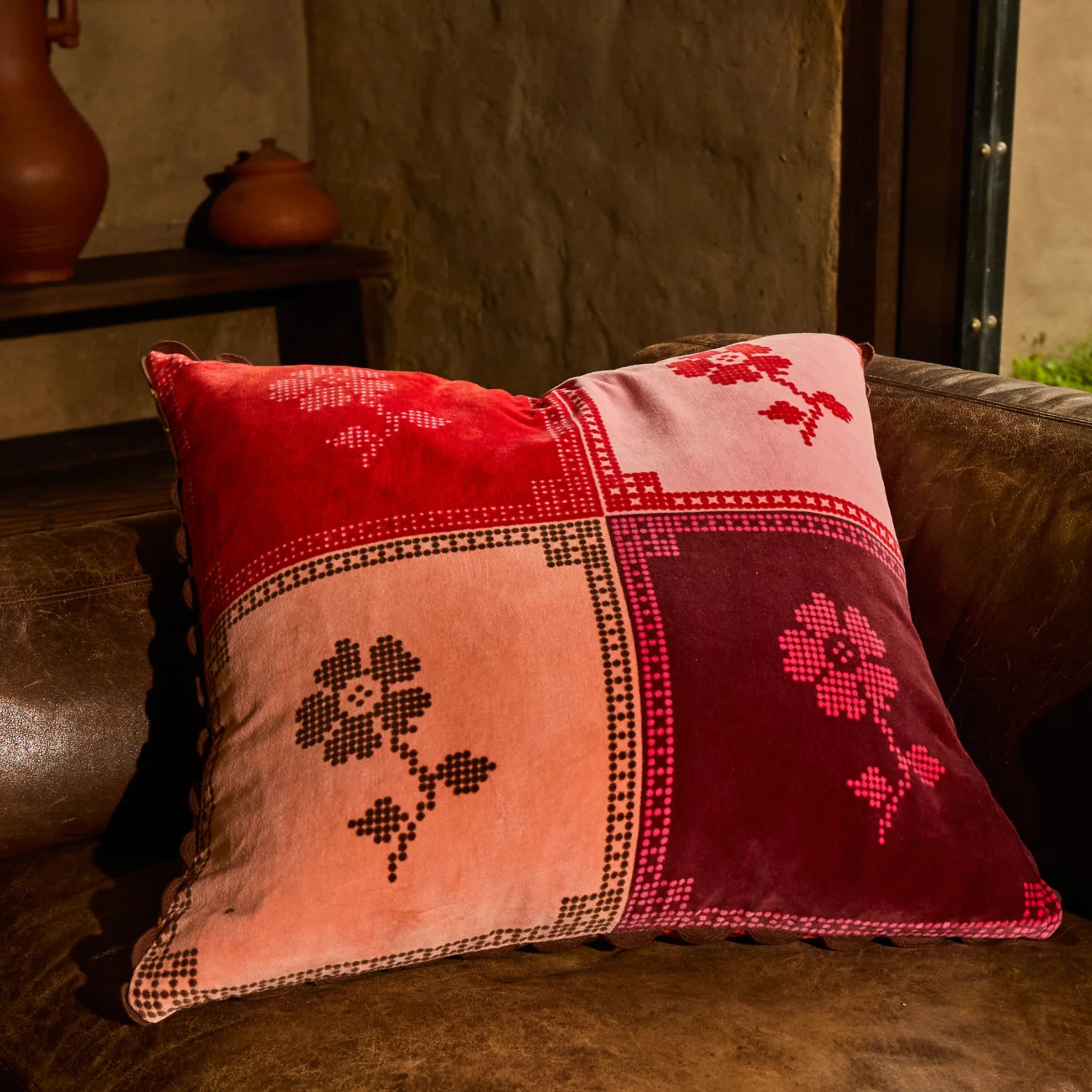 a floral print color block square pillow. 