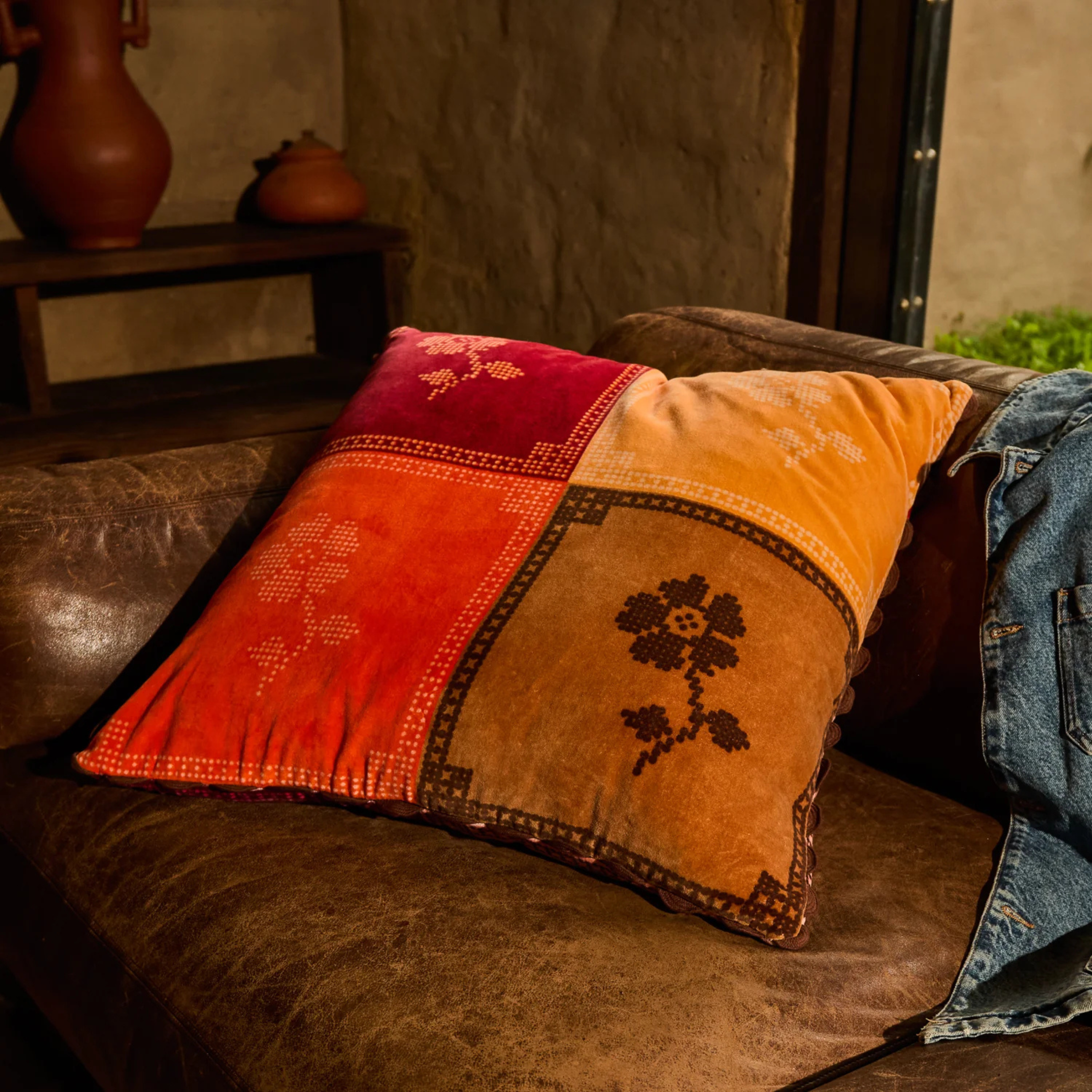 a floral print color block square pillow. 