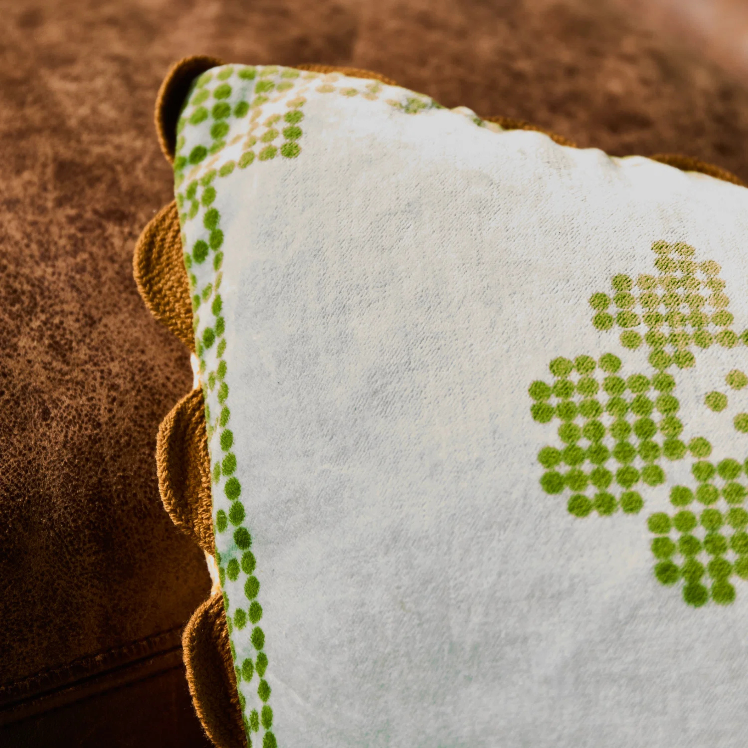 a reversible pillow with a floral print and color block design. 