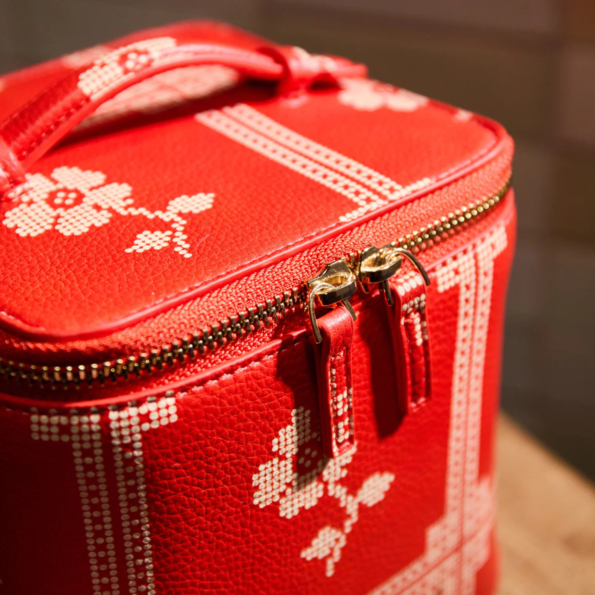a red and cream vanity case. 