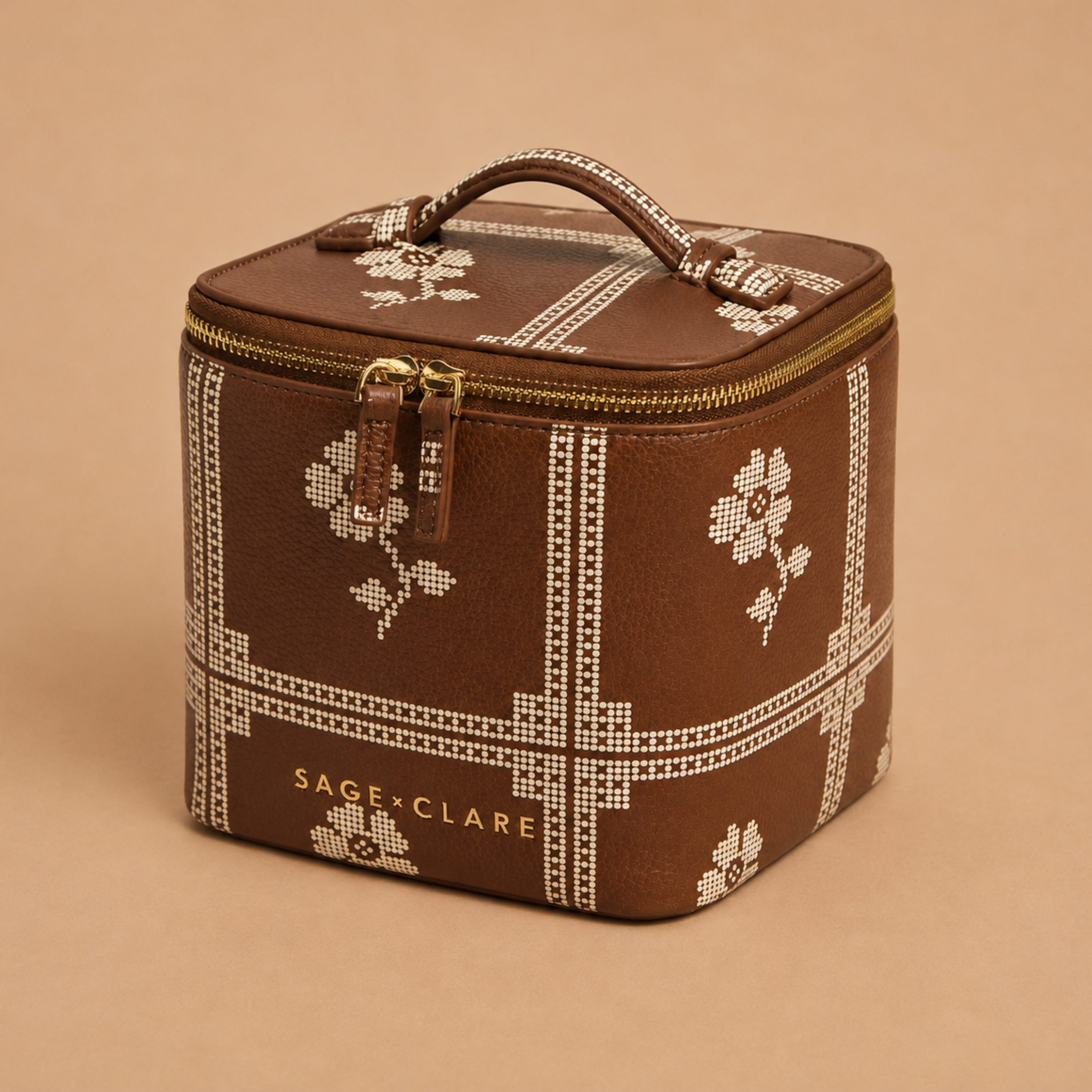 a brown and cream cosmetic case. 