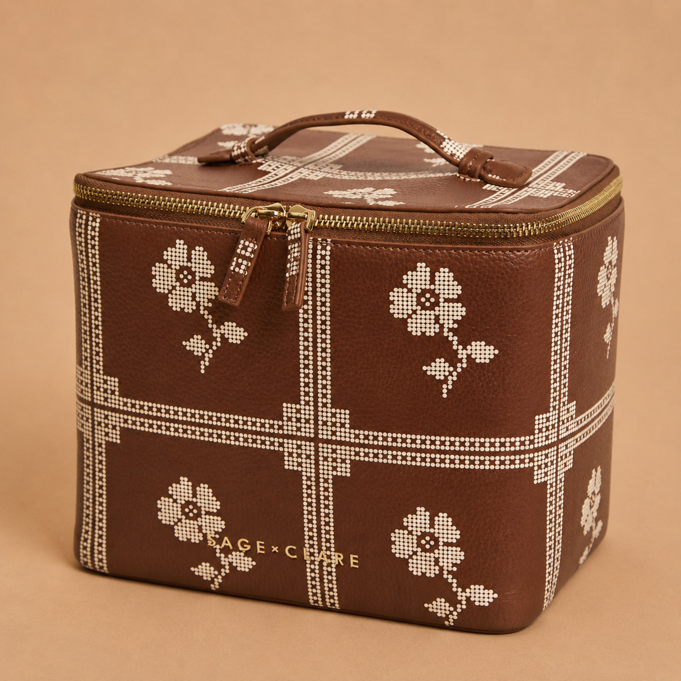 a brown and cream cosmetic case. 