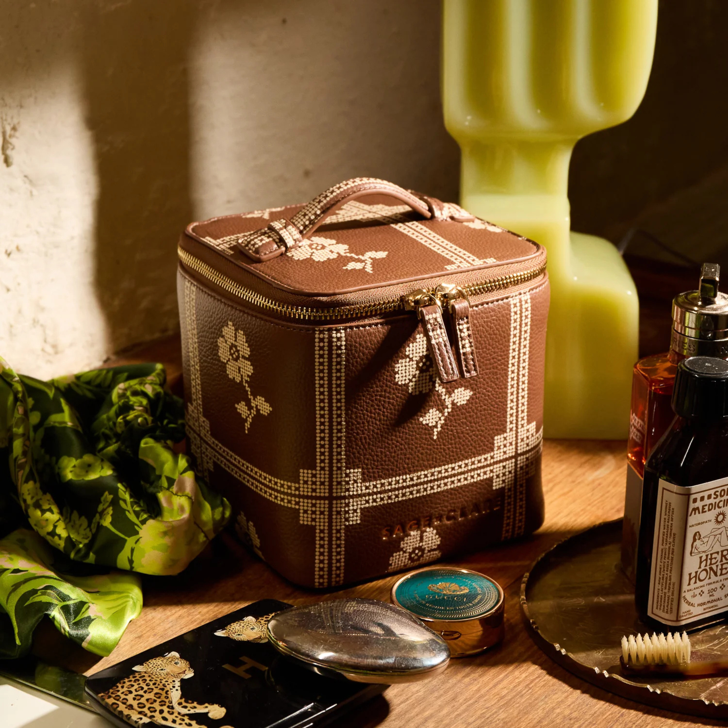 a brown and cream cosmetic case. 