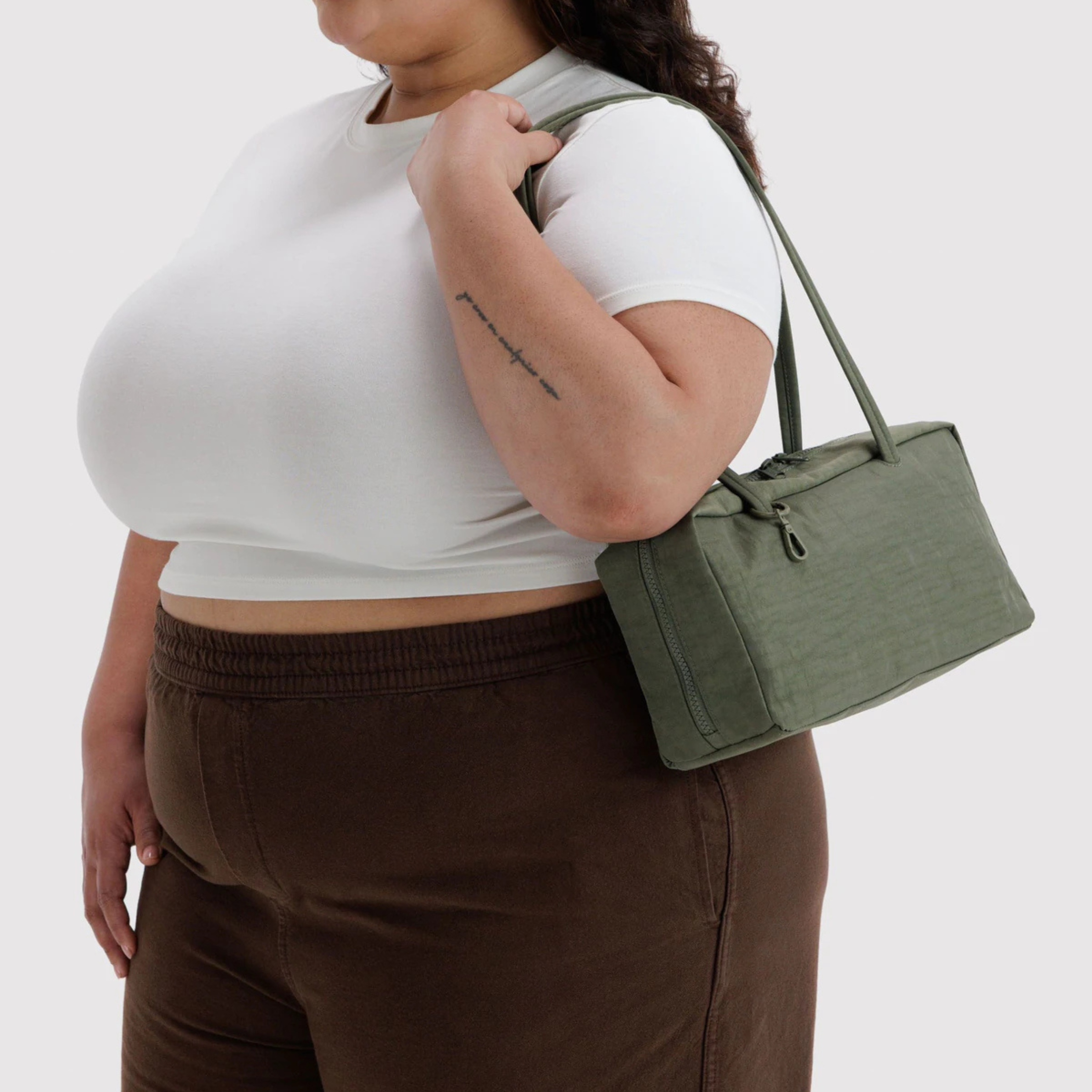 A green nylon shoulder bag.