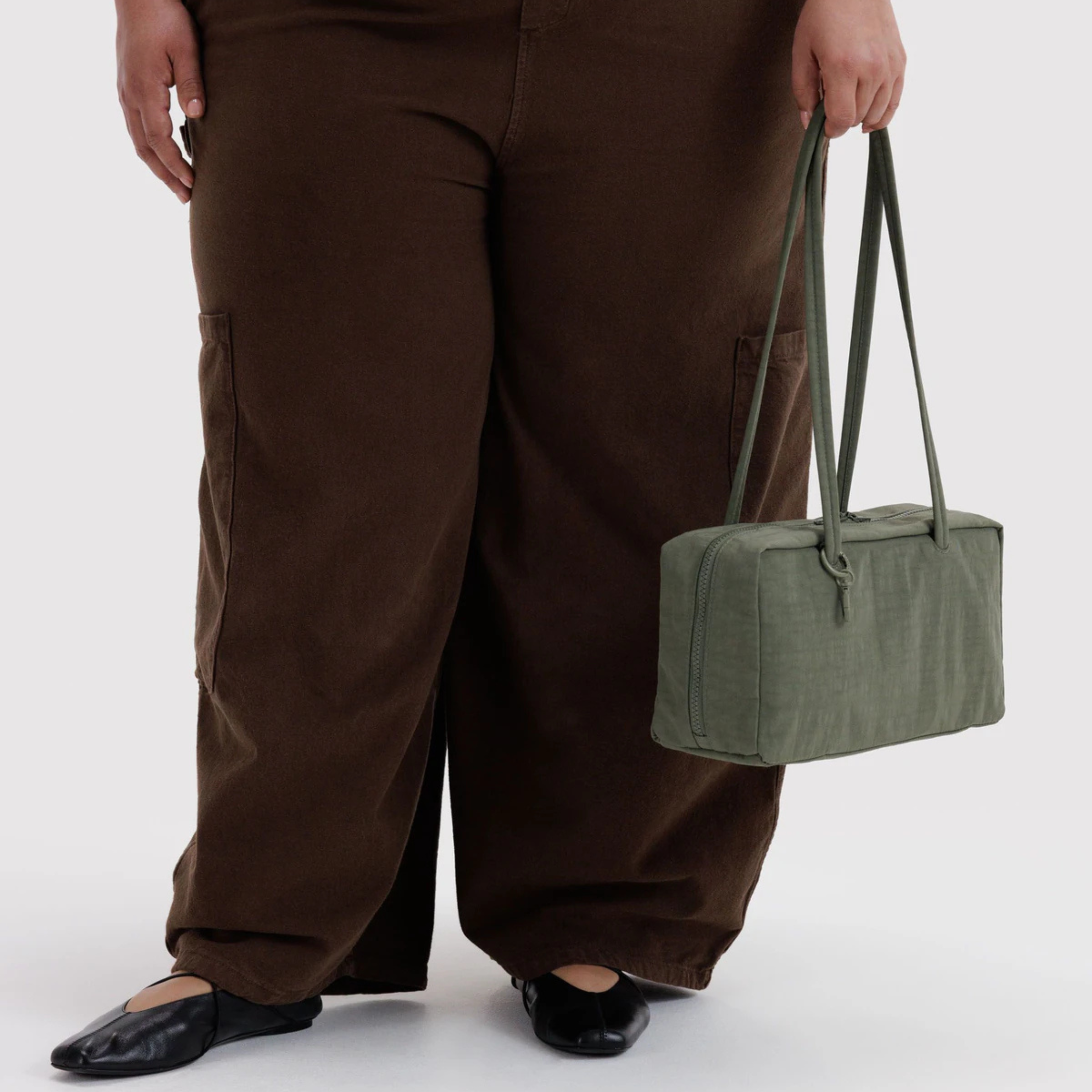 A green nylon shoulder bag.