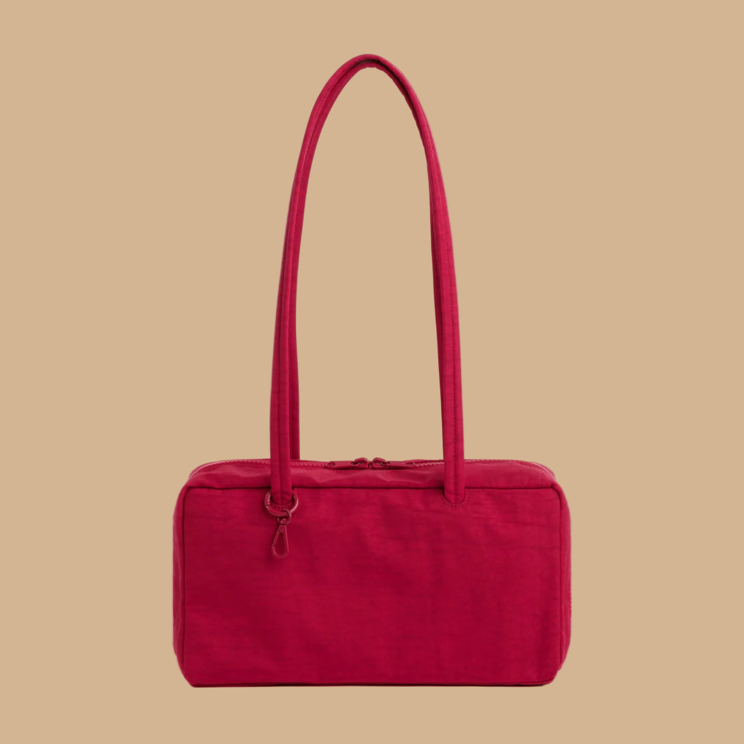 A red handbag with a shoulder strap.