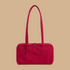 A red handbag with a shoulder strap.