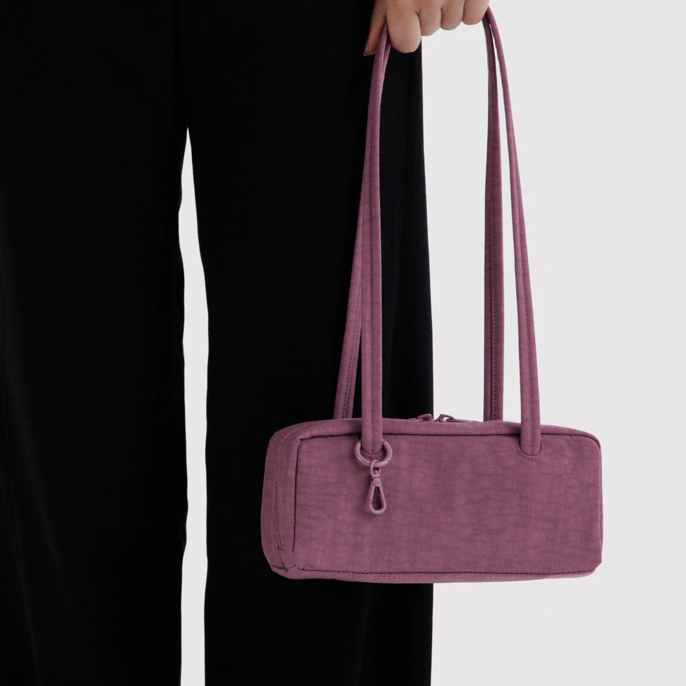 A purple rectangle shaped shoulder bag.