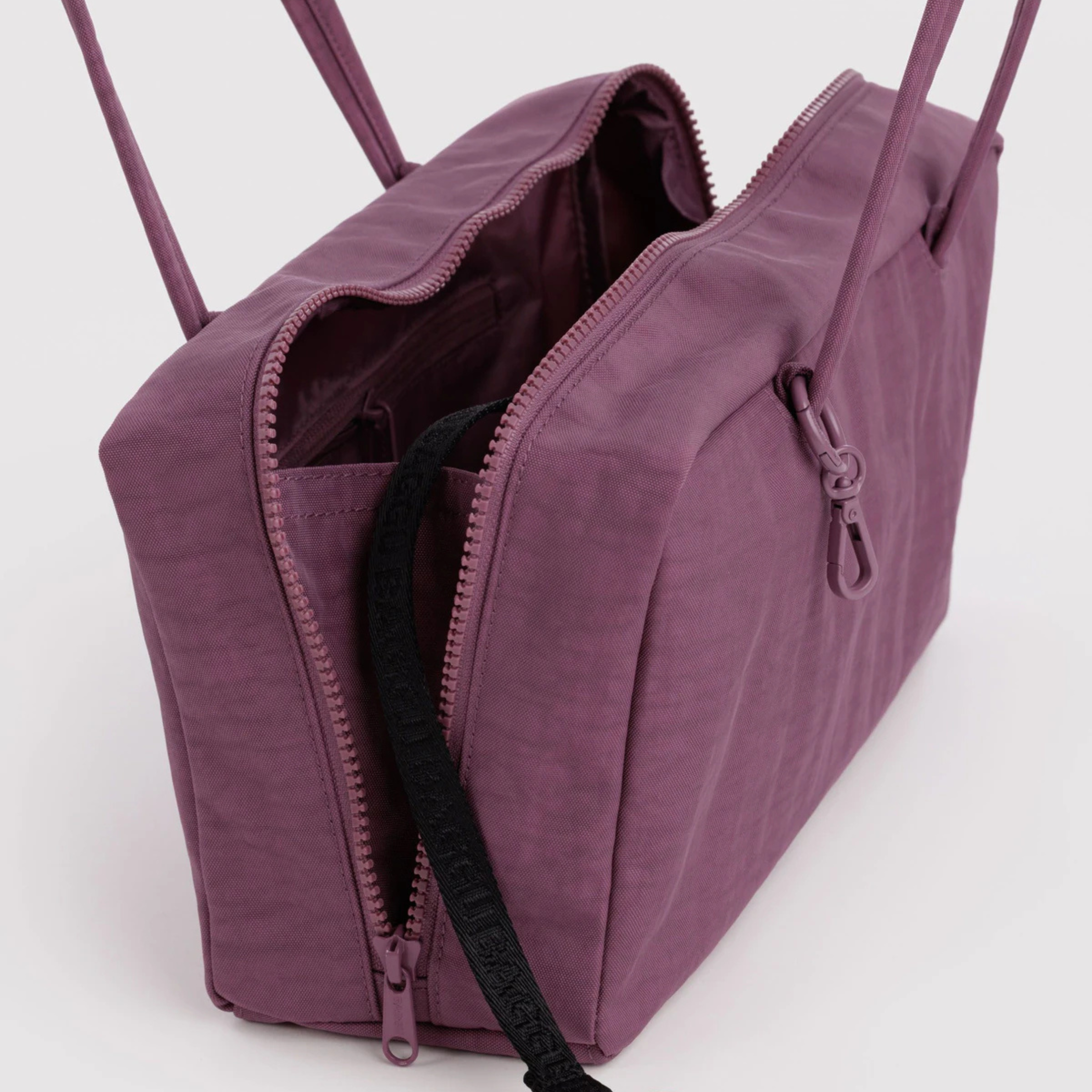 A purple rectangle shaped shoulder bag.