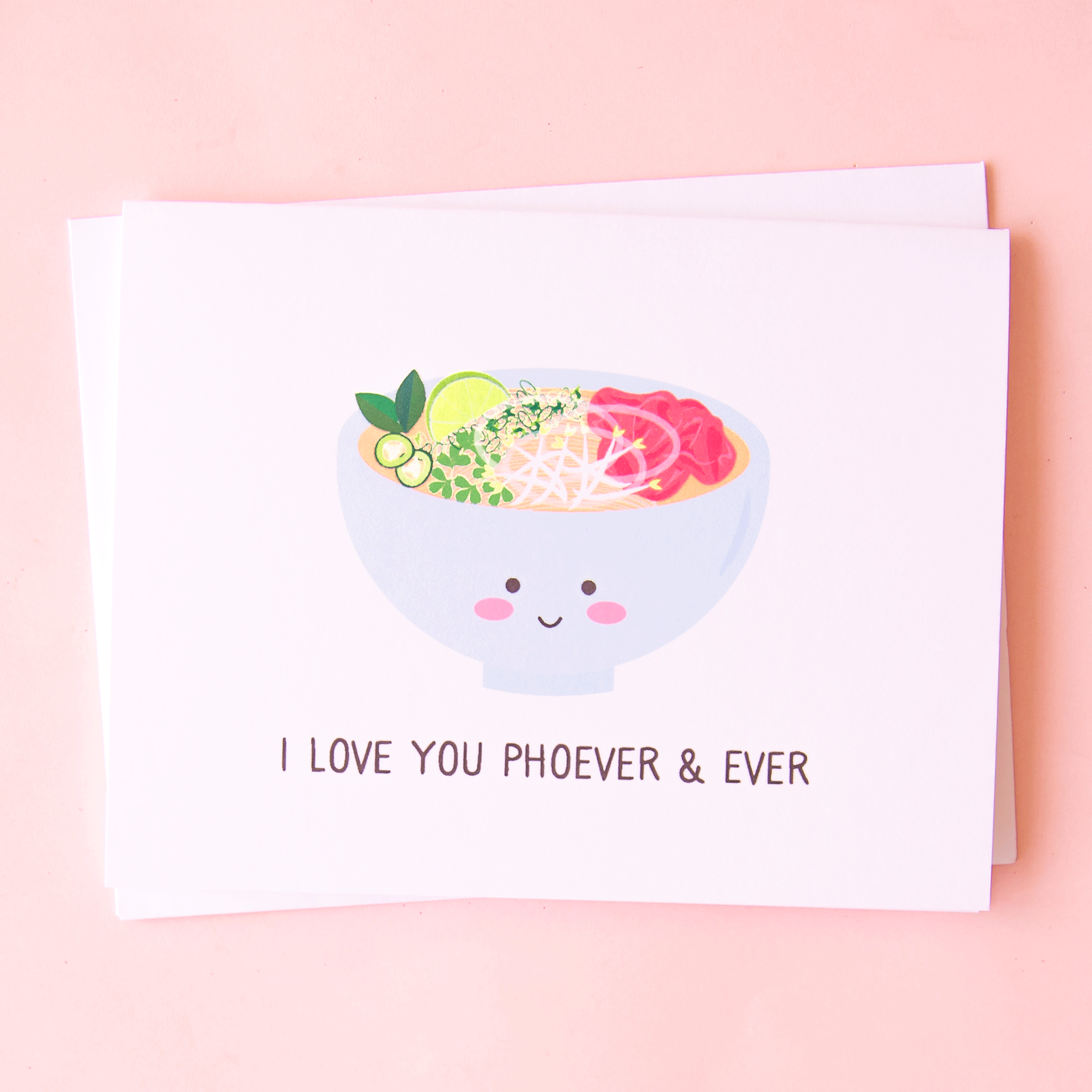A white card with a colorful bowl of pho in a light blue bowl that has a smiling face and text underneath that reads, &quot;I Love You Phoever &amp; Ever&quot; in black letters.