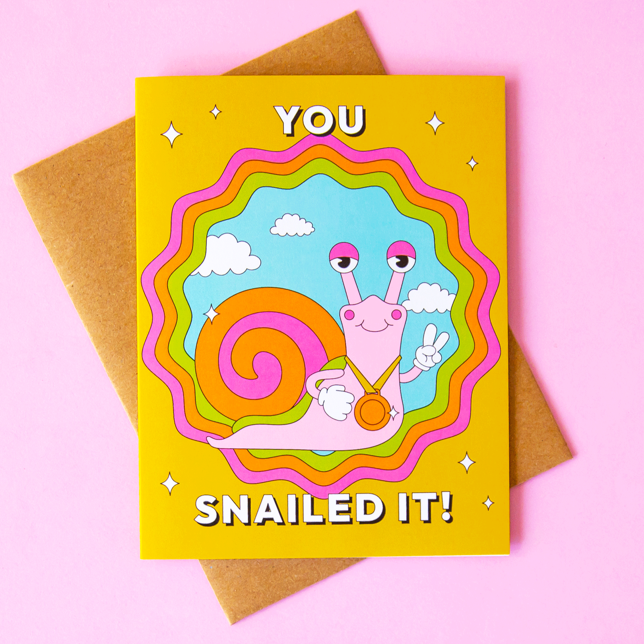 On a purple background is a yellow and multi colored card with a snail illustration and white text above and below that reads, "You Snailed It".