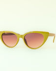 A green pair of cat-eye shaped sunglasses with a brown lens.