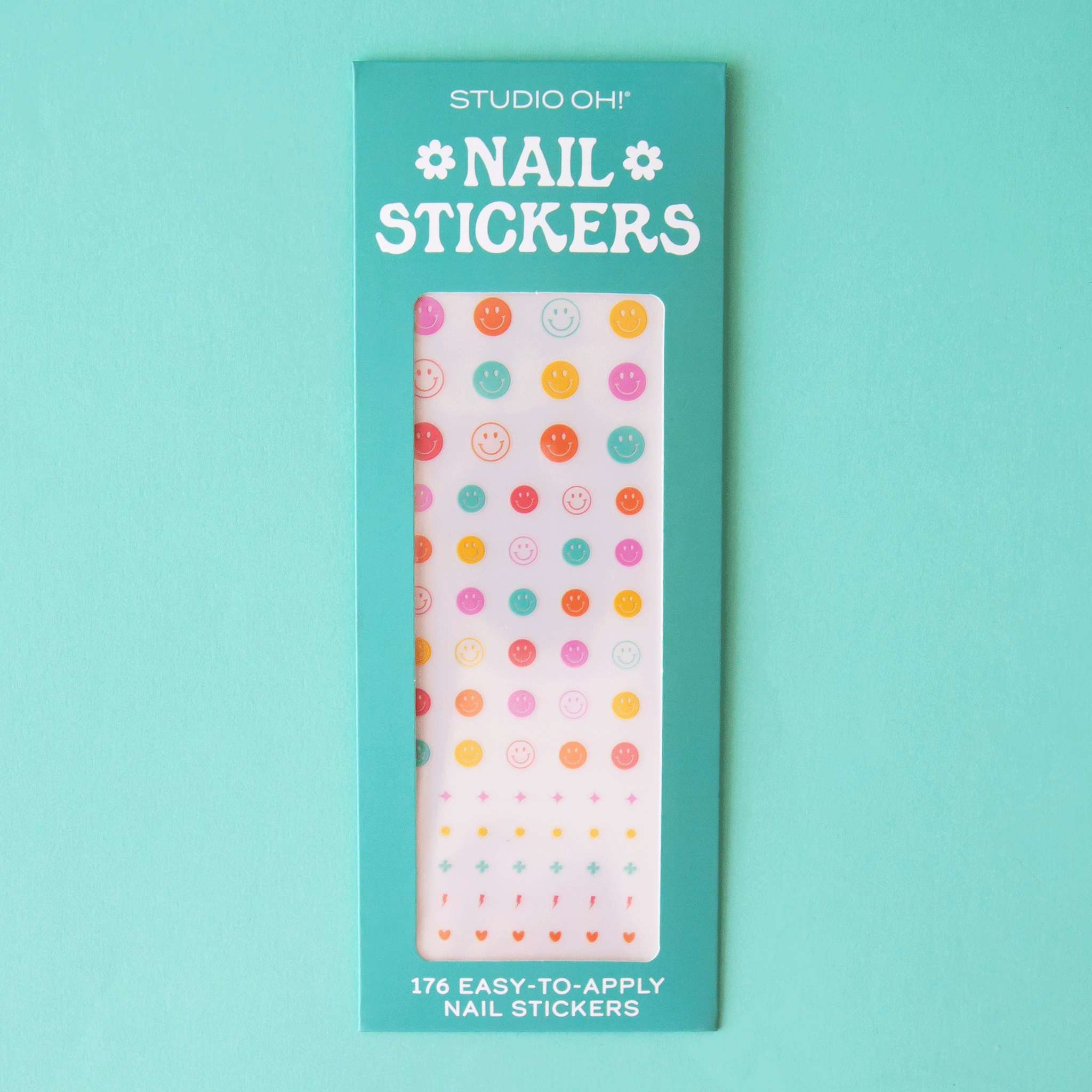 On an aqua background is a pack of nail stickers in multi-colored smiley faces.