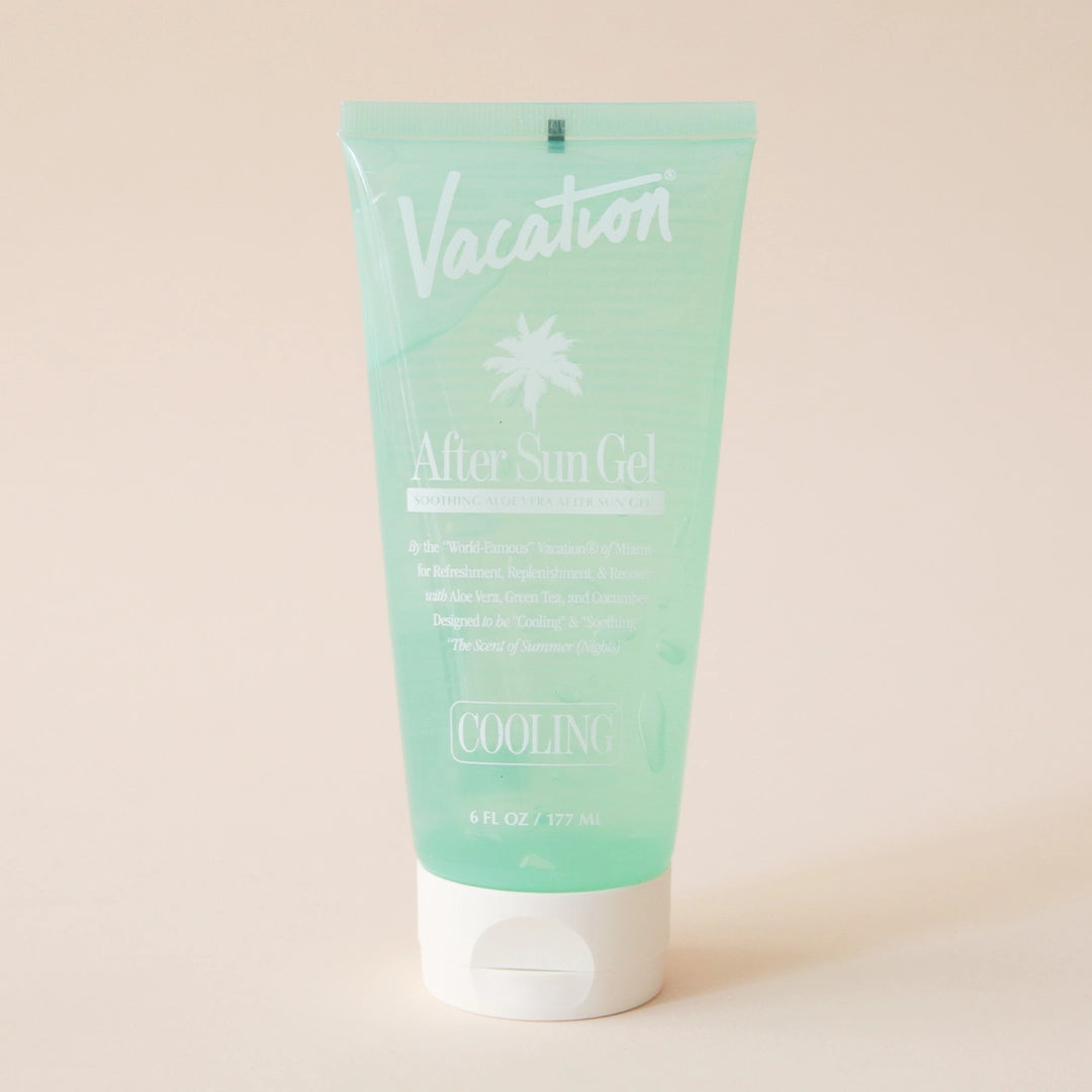 A green bottle of after sun aloe gel with white text and an ivory squeeze tube top.