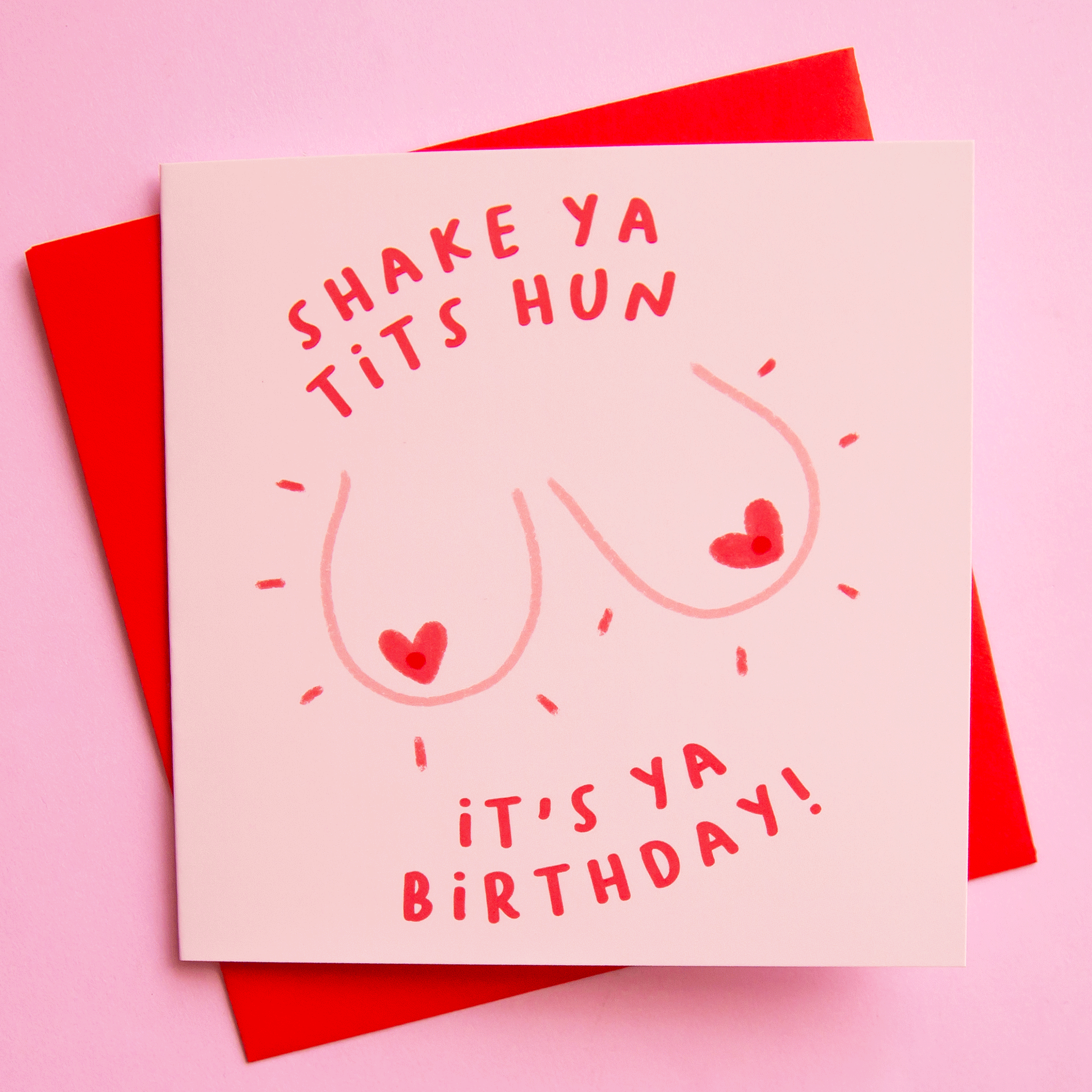 A pink birthday card that reads, "Shake Ya Tits Hun It's Ya Birthday!".