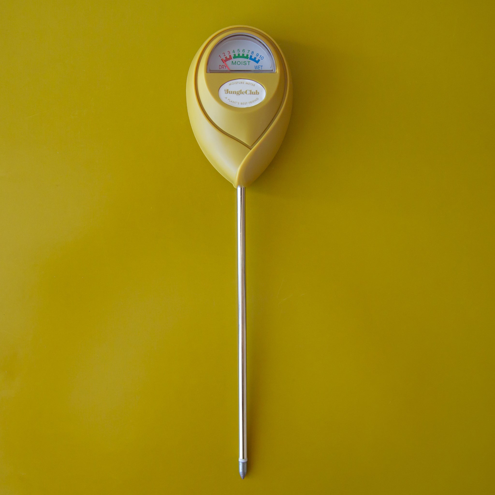 A chartreuse moisture meter with a rounded head and a white meter that ranges from dry, moist, or wet along with a small oval label in the front that reads, &quot;Jungle Club&quot;.