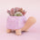 On a light pink background is lilac ceramic turtle shaped planter.