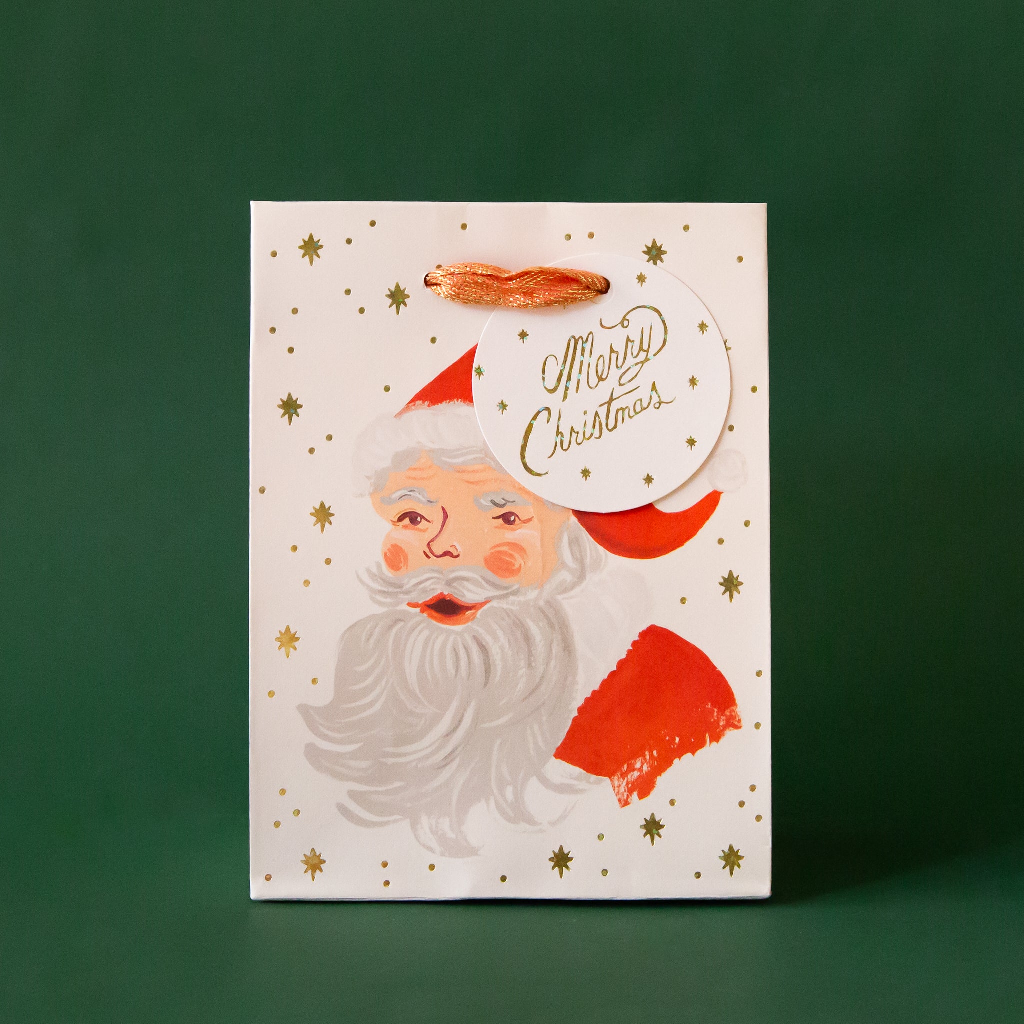 The smallest gift bag with an illustration of Santa Clause. 