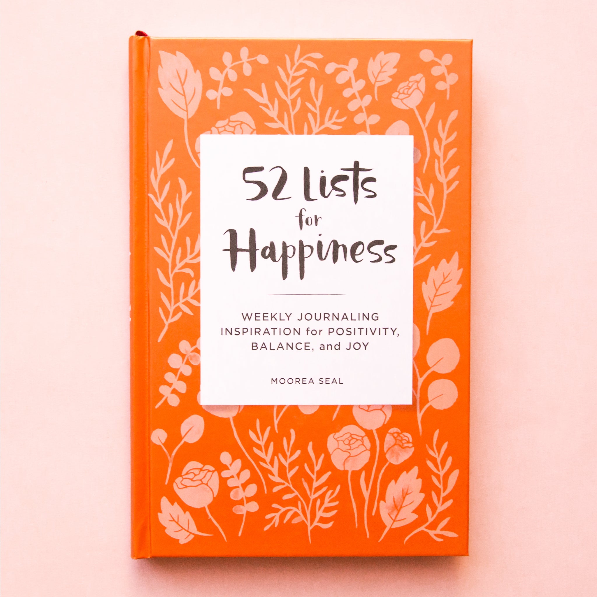 52 lists for happiness. weekly journaling inspiration for positivity, balance, and joy by moorea seal. terracotta colored cover with flower and leaf illustrations.