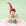 On a green background is a resin elf figuring with a red hat, green outfit and holding a paper. 