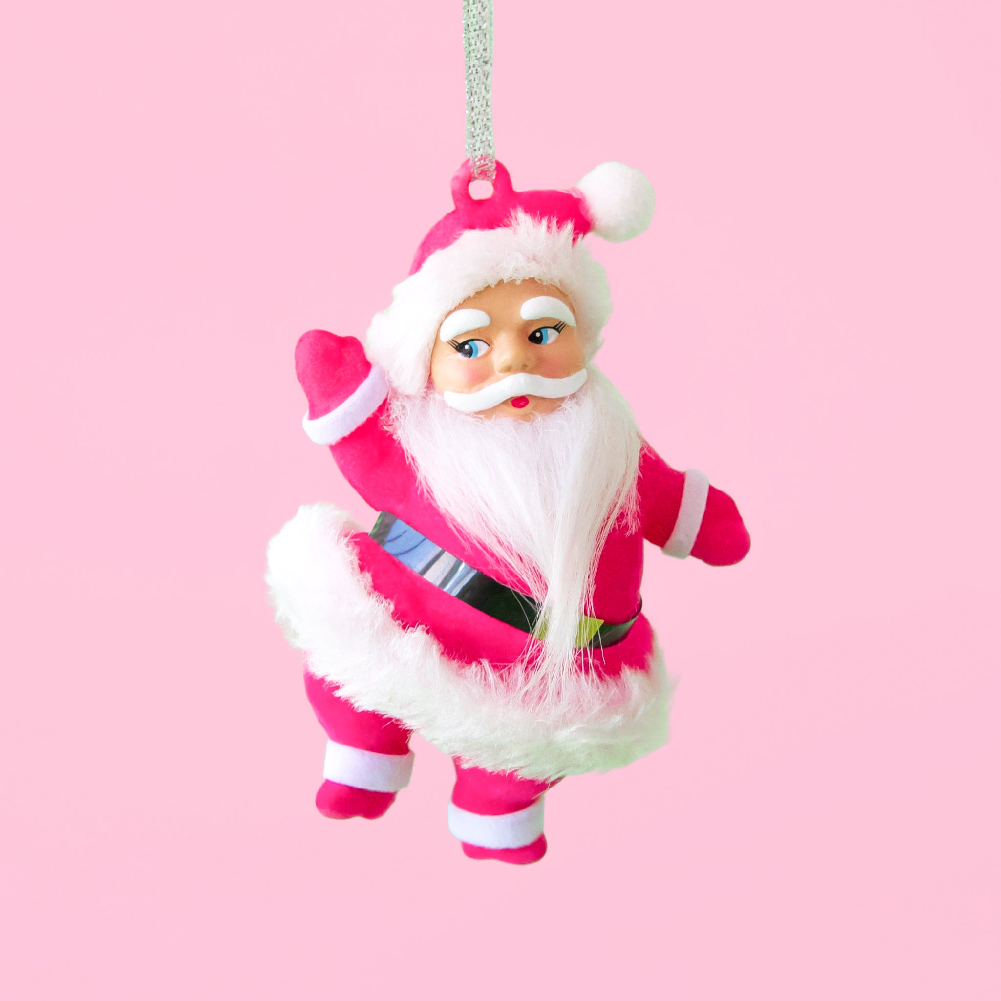 A hot pink suited Santa shape holiday ornament. 