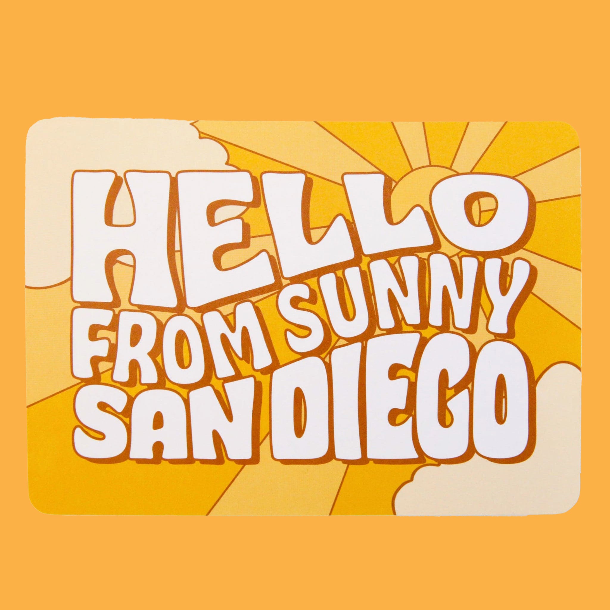 On a yellow background is a yellow postcard with a sun and sunray illustration along with text in the center that reads, "Hello From Sunny San Diego" in cream letters.