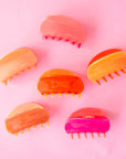All three of our two-toned claw clips side by side in tones of pink and orange.