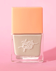 A sage green satin nail polish in a glass bottle with a peachy square lid.