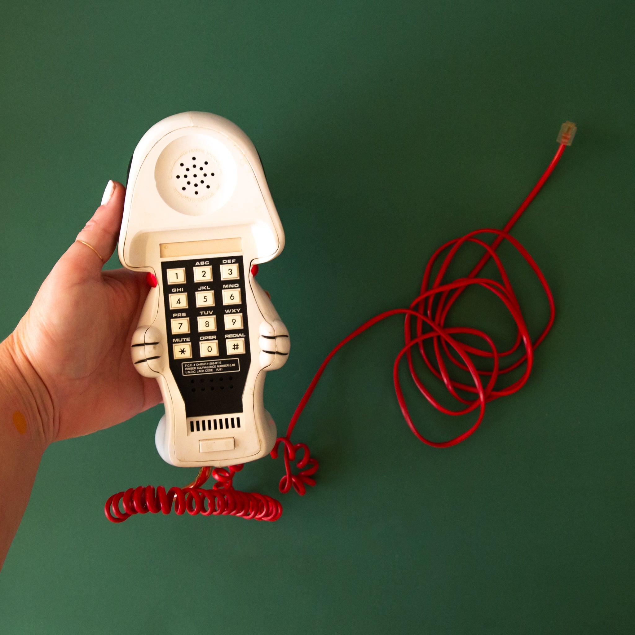 A Snoopy shaped vintage corded telephone. 