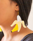 Banana shaped earrings with a gold plated hook.