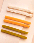 On a white packaging is six bobby pin clips in three different colors. From top to bottom is an ivory shell shade, mango orange, and olive green shade. 