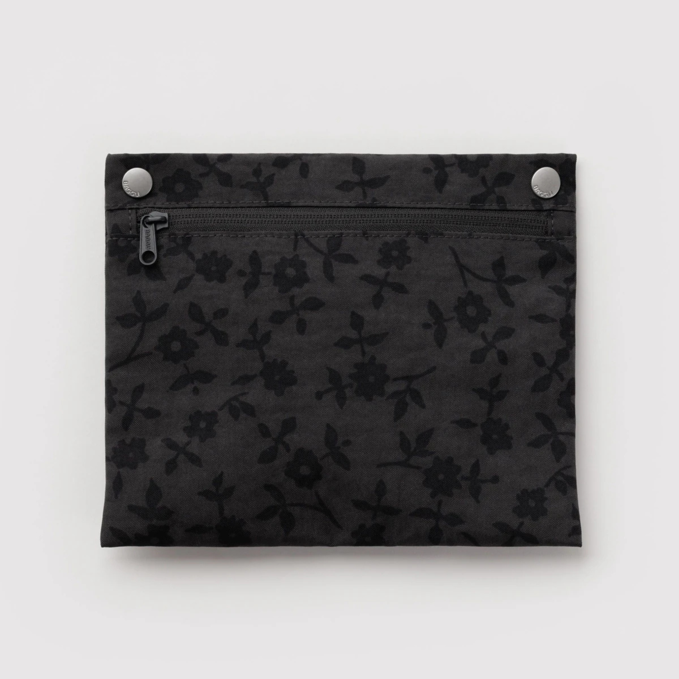 A black and grey tote bag with a floral pattern.