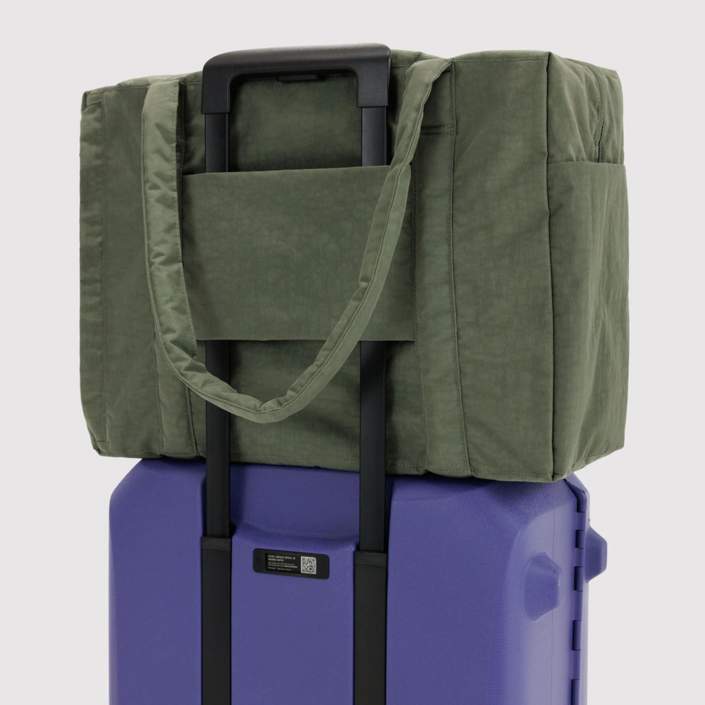 A green carry on bag. 