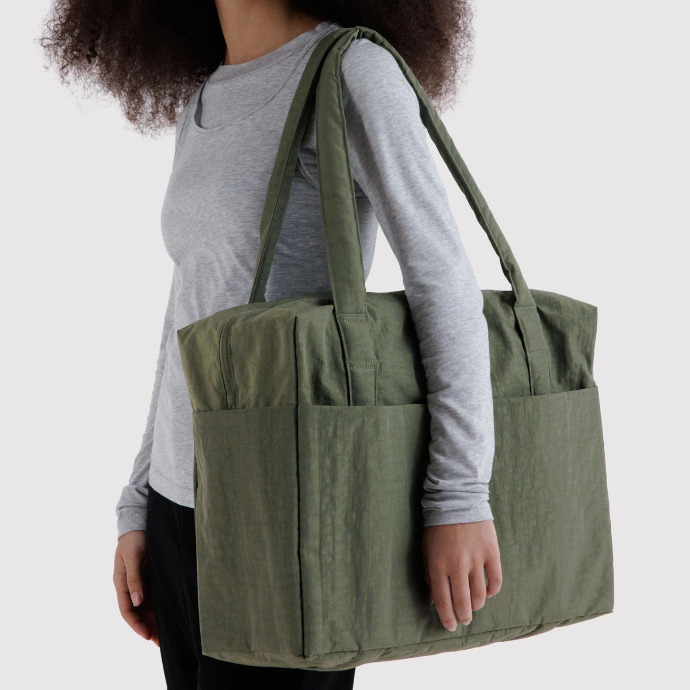 A green carry on bag. 