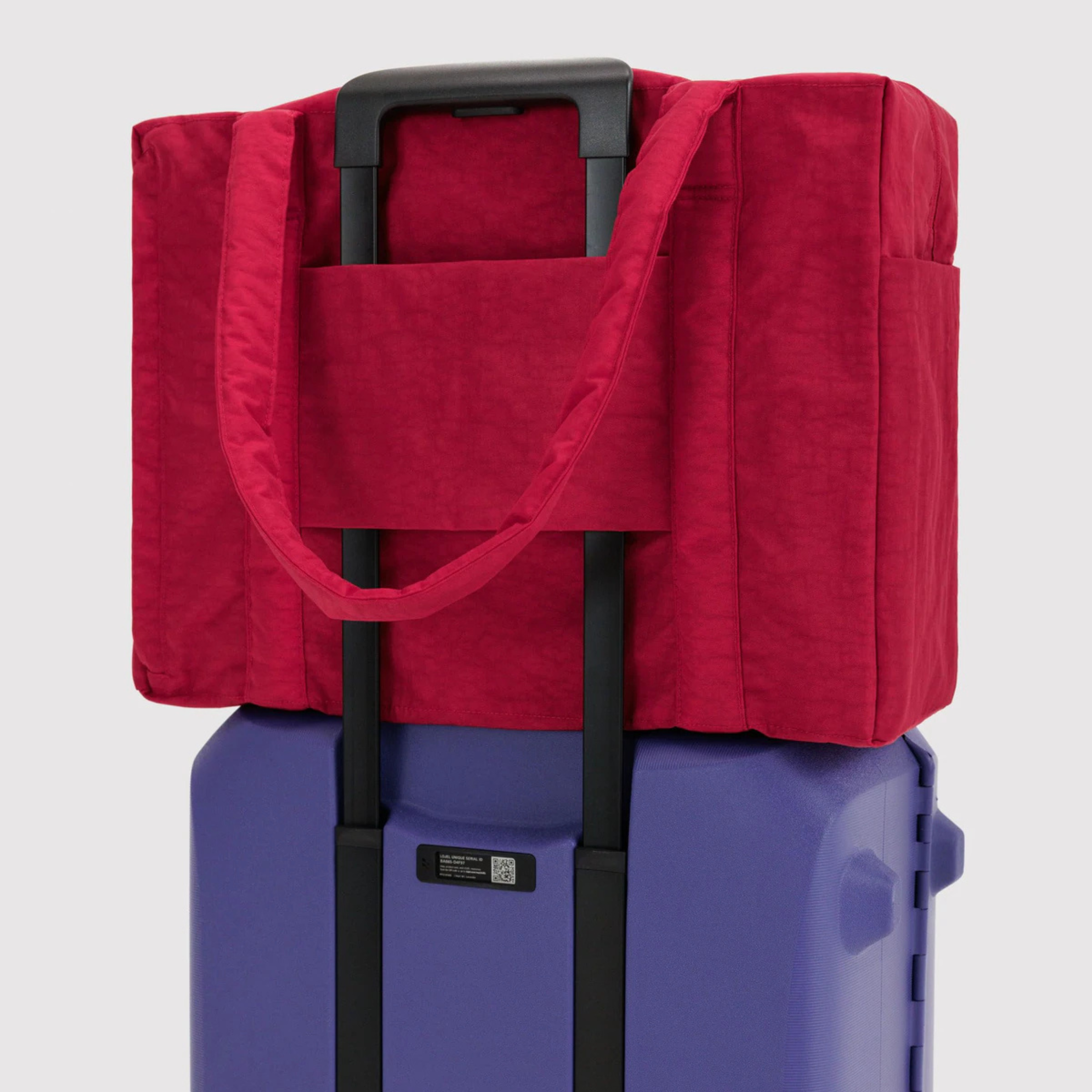 A red carry on bag. 