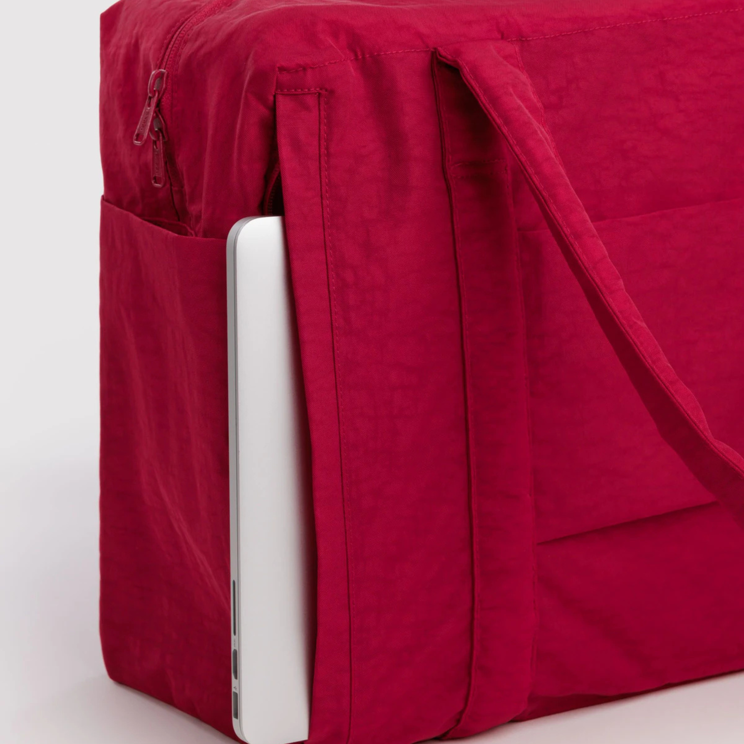 A red carry on bag. 